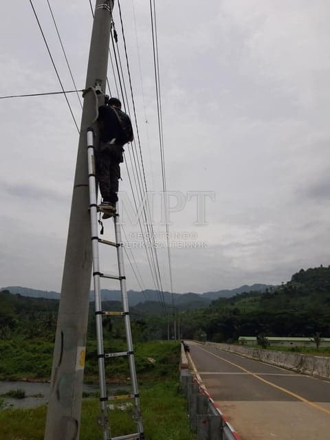 CCTV installation on a pole in an open area